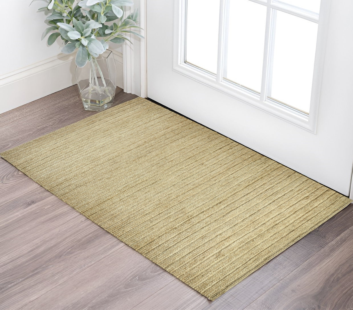 5' X 8' Tan Ivory And Taupe Hand Woven Area Rug